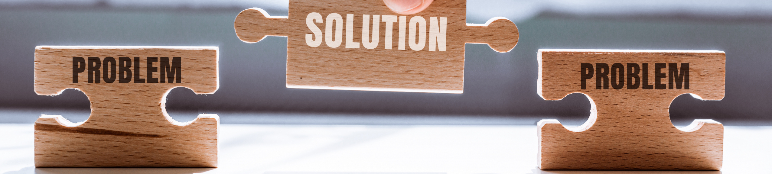 Hand,Holding,A,Wooden,Puzzle,With,The,Word,Solution.,There